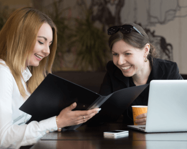 A translator assisting a customer with affordable document translation services in Perris, CA.