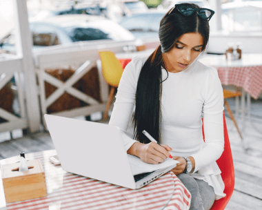 Professional working on a laptop, representing high-quality Armenian translation services in Glendale for business, & legal.