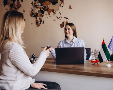 Professionals discussing the importance of immigration translation services in Watsonville for travel and relocation.